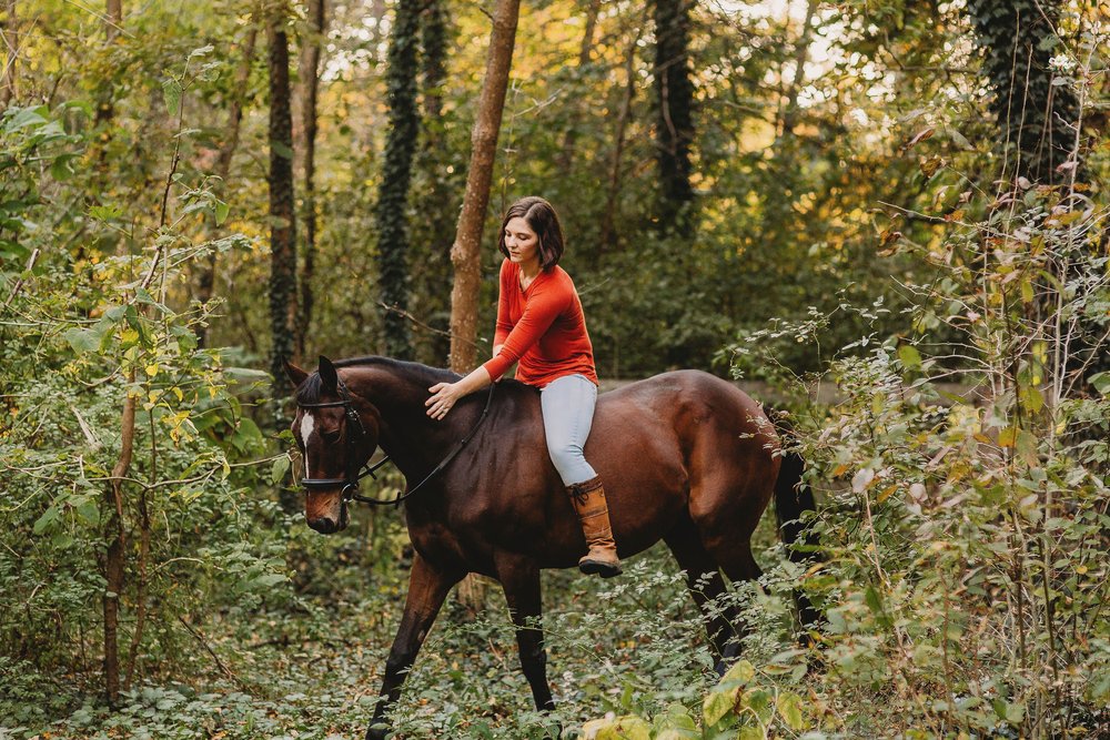 Sonja riding Luna bareback through the autumn woods